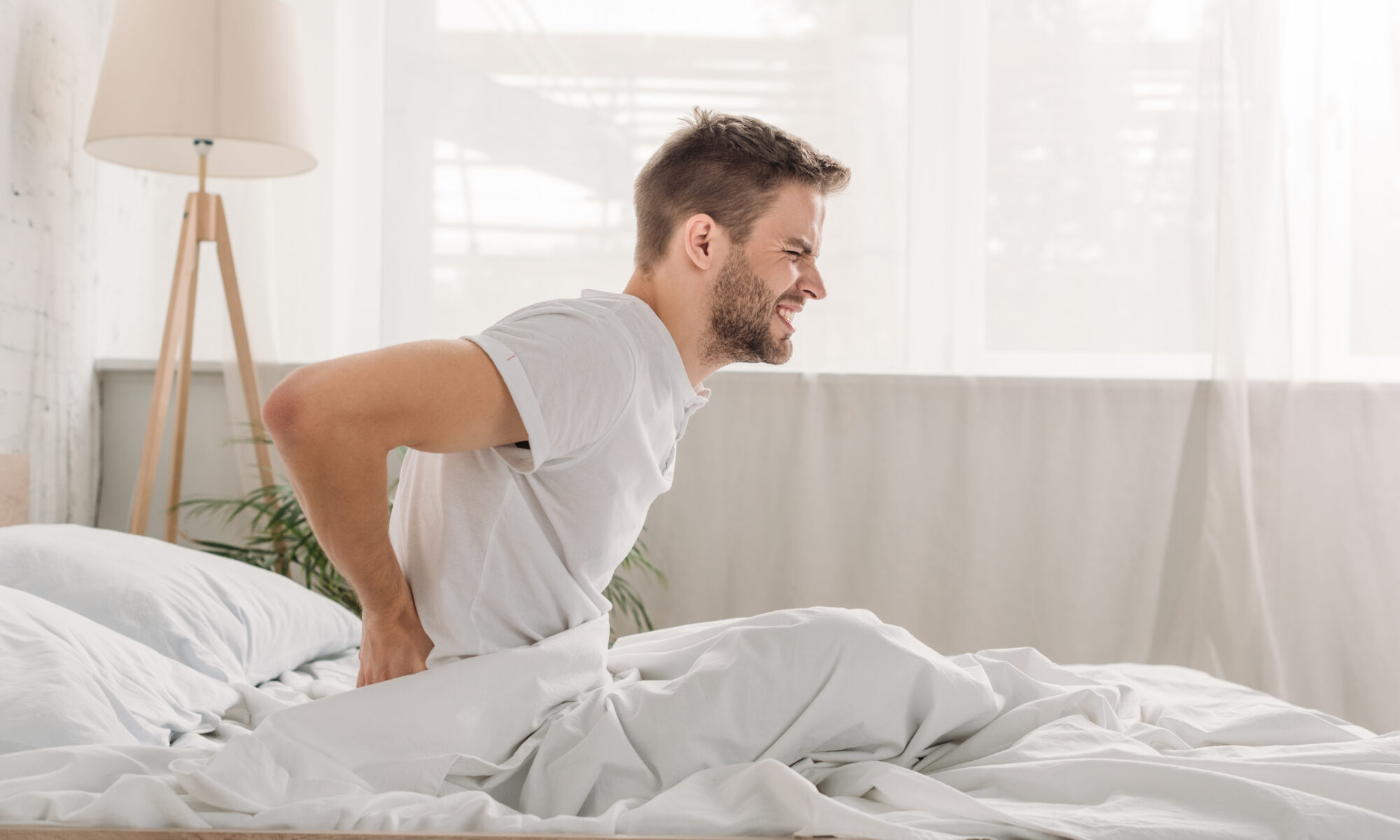 Man with morning back and spine pain